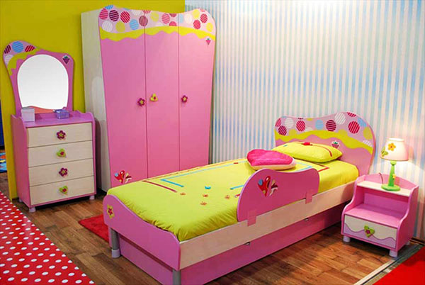 Nursery for a girl with a pink wardrobe