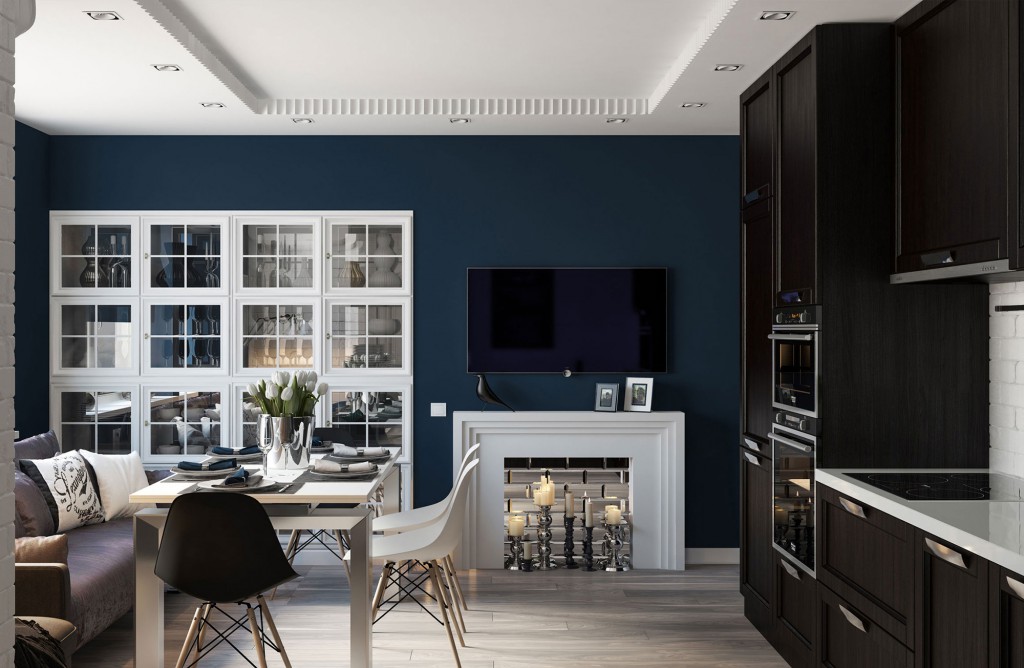 Combined black and white living room and kitchen