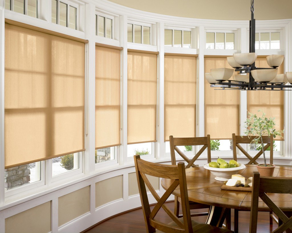 Beige roller blinds in a large kitchen