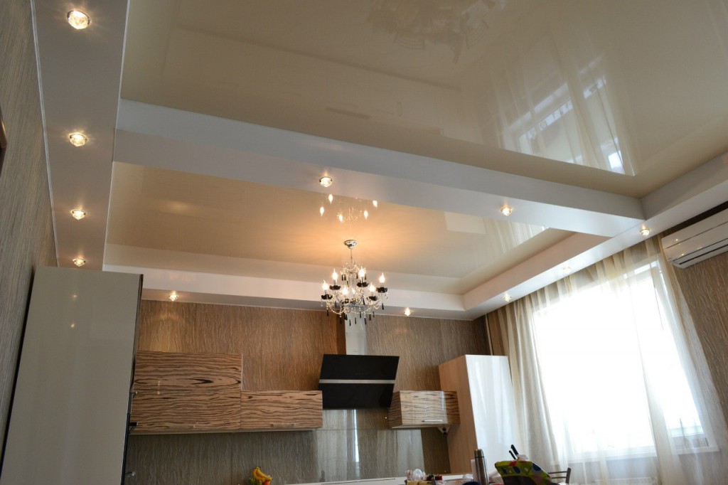 Creamy white glossy stretch ceiling in the kitchen