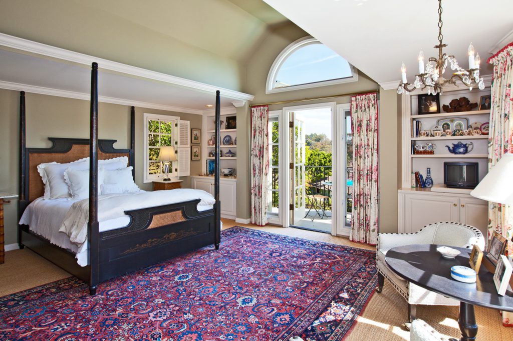 Patterned rug in a country bedroom