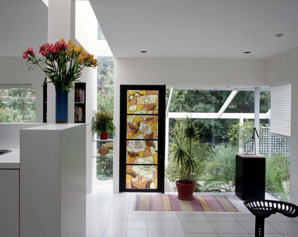 Stained glass window in the interior of a bright house