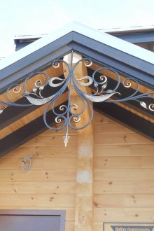 Beautiful visor made of wood and metal with wrought iron elements