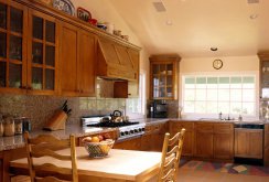 Cozy kitchen with wooden furniture in a private house