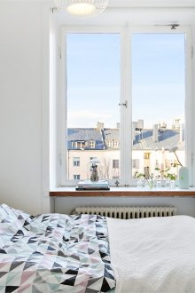 Ментави акценти в светла спалня