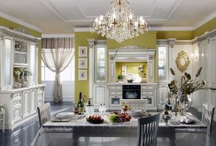 Chandelier on a white and light green kitchen in a classic style