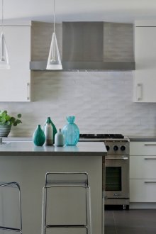 White minimalist kitchen with blue accents
