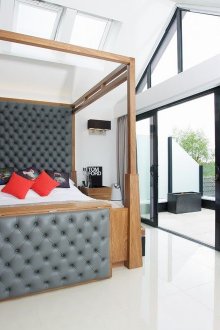 Wooden bed decorated with gray leather