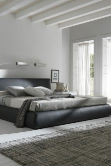 Black, gray and white colors in the bedroom in the style of minimalism.