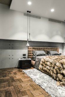 Minimalist bedroom with a fur bedspread