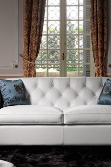 White sofa in the living room in the neoclassical style