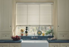 Horizontal blinds above a sink in the kitchen