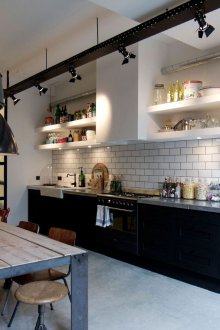 Cozy black and white loft style kitchen