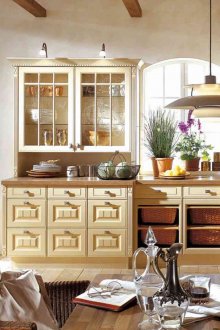 White walls and wooden floor in the kitchen in the style of shabby chic