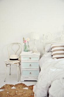 White walls and floor in a shabby chic bedroom