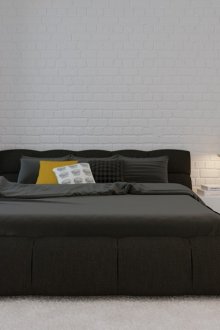 Graues Bett in einem weißen Schlafzimmer im Stil des Minimalismus