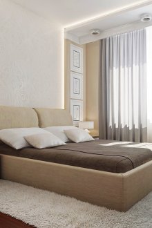 Katil beige di dalam bilik tidur