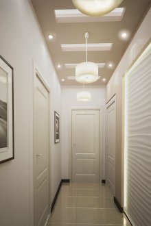 Three chandeliers and spotlights in the hallway