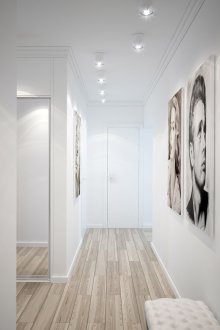 Spotlights in a white hallway