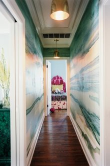 Two metal chandeliers in the hallway