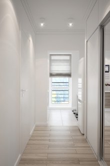 Spotlights in the brown and white corridor