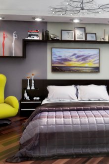 Perabot hitam dan kuning di dalam bilik tidur