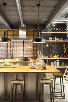 Brown and black loft style island kitchen