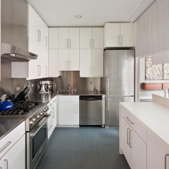 White kitchen in loft style apartment