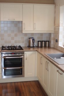 Small beige and brown kitchen