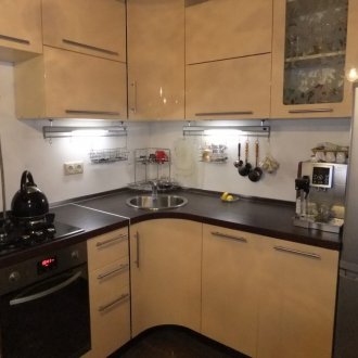 Beige and black corner kitchen