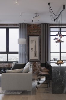 Сиви, черни и кафяви цветове в интериора на хола-кухнята