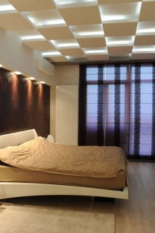 Beige, white and brown in the bedroom.