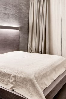 Minimalist beige and brown bedroom