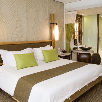 White, beige, green and brown colors in the bedroom in eco-style