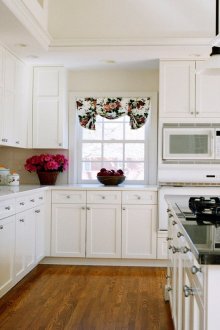 Bright kitchen with an island in the house