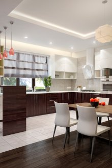 Brown and white kitchen with coral accents