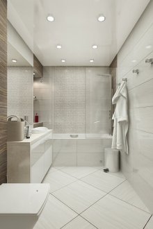 Batu dan jubin kayu dalam reka bentuk bilik mandi