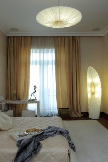 Beige and black spacious bedroom