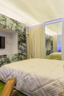 Eco-friendly green carpet and wall in bedroom