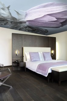 Lilac accents in a modern black and white bedroom