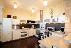 Beautiful chandeliers in the plasterboard ceiling in the kitchen