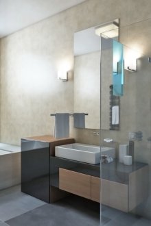 High-tech chandelier and sconce in the bathroom