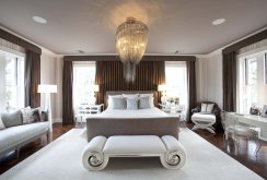 Beautiful chandelier in the neoclassical bedroom