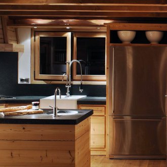 Solid wood table on steel legs in the interior of the apartment
