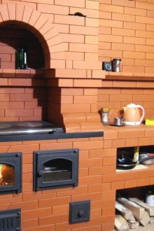 Wrought iron porch of a brick house.