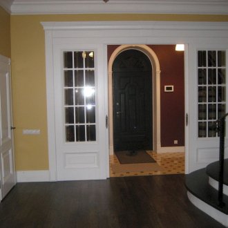 Fridge under the window with sliding doors