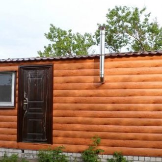 Wrought-iron porch of a bar-house