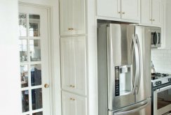 Two-door refrigerator in the white kitchen