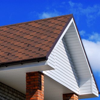 Paneling the gable of the house
