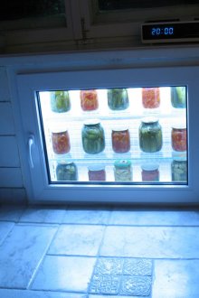 Refrigerator under the window with light